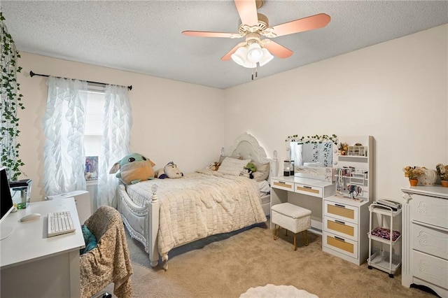 17507 E 35th Ter, Independence, MO 64055 - bedroom with light carpet, ceiling fan, a textured ceiling, and a desk