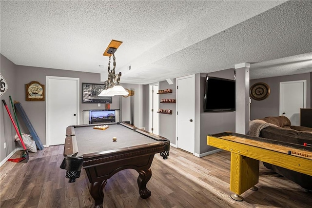 17507 E 35th Ter, Independence, MO 64055 - recreation room featuring pool table, wood finished floors, and a textured ceiling