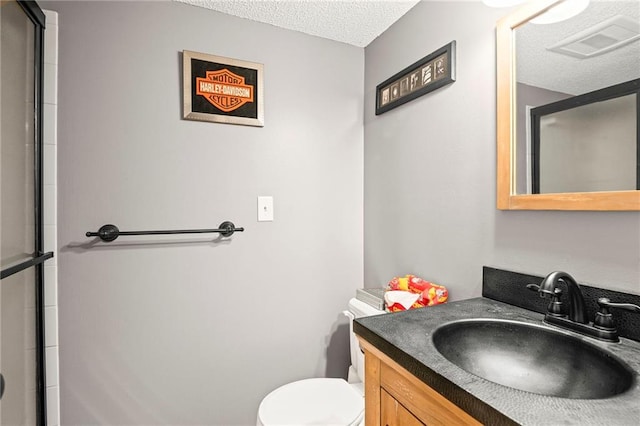 17507 E 35th Ter, Independence, MO 64055 - full bath featuring a textured ceiling, vanity, and an enclosed shower