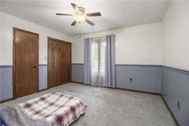 2005 NW Fawn Dr, Blue Springs, MO 64015 - carpeted bedroom featuring a ceiling fan and baseboards