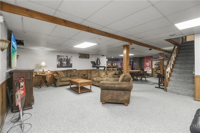 2005 NW Fawn Dr, Blue Springs, MO 64015 - living room with a paneled ceiling, stairway, carpet floors, wainscoting, and wooden walls