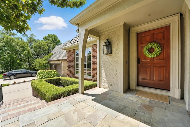 28 Le Mans Ct, Prairie Village, KS 66208 - view of exterior entry featuring stucco siding