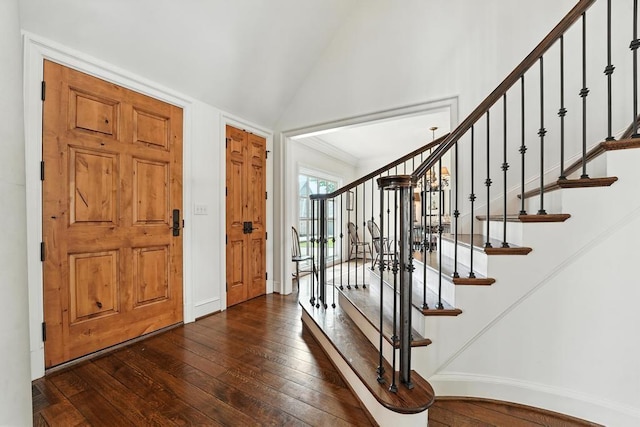 28 Le Mans Ct, Prairie Village, KS 66208 - entryway with dark wood-type flooring, vaulted ceiling, and stairs
