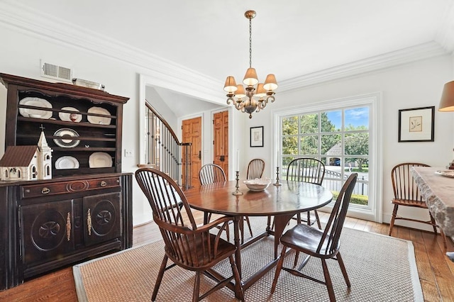 28 Le Mans Ct, Prairie Village, KS 66208 - dining space featuring ornamental molding, a chandelier, hardwood / wood-style floors, and stairs