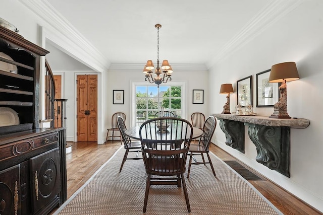 28 Le Mans Ct, Prairie Village, KS 66208 - dining space featuring a chandelier, wood finished floors, and ornamental molding