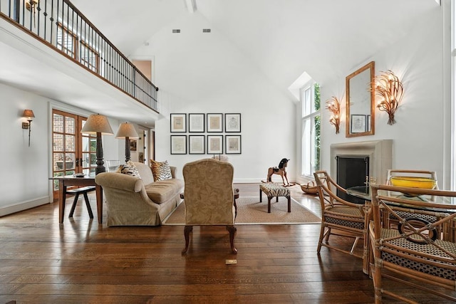 28 Le Mans Ct, Prairie Village, KS 66208 - living room featuring high vaulted ceiling, healthy amount of natural light, a fireplace, and wood-type flooring