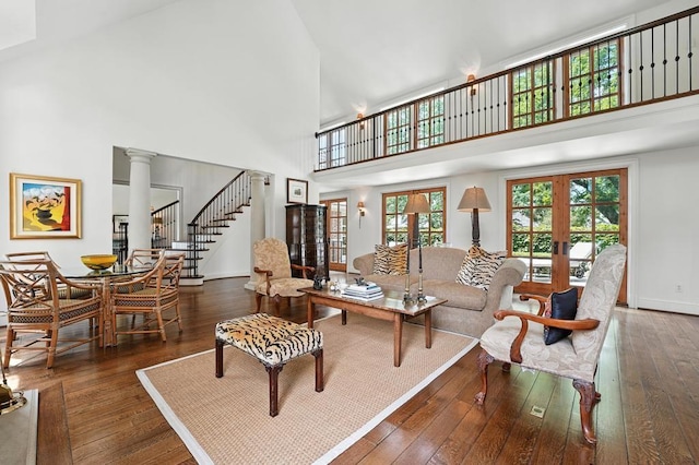 28 Le Mans Ct, Prairie Village, KS 66208 - living area featuring a towering ceiling, hardwood / wood-style flooring, stairway, french doors, and ornate columns
