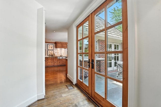 28 Le Mans Ct, Prairie Village, KS 66208 - doorway to outside with light wood-style flooring and french doors