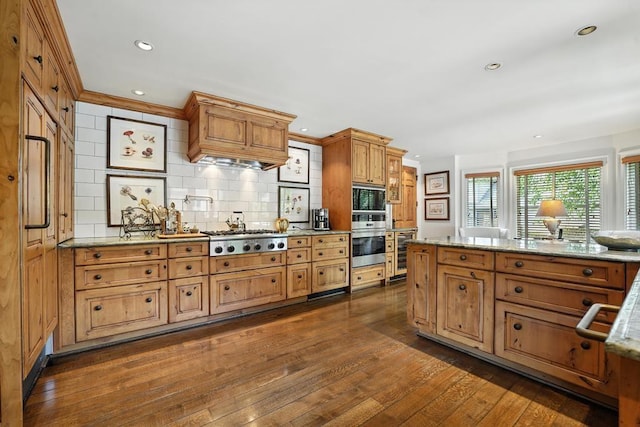 28 Le Mans Ct, Prairie Village, KS 66208 - kitchen with appliances with stainless steel finishes, dark wood finished floors, backsplash, beverage cooler, and light stone countertops