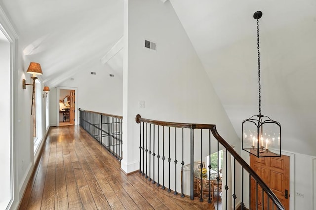 28 Le Mans Ct, Prairie Village, KS 66208 - hall featuring a chandelier, hardwood / wood-style floors, an upstairs landing, and high vaulted ceiling