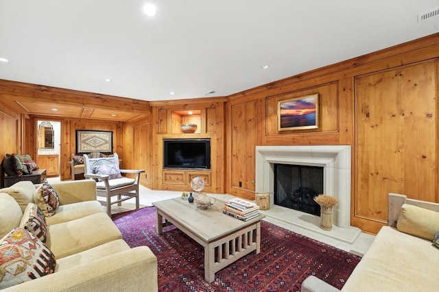 28 Le Mans Ct, Prairie Village, KS 66208 - living room with wood walls, a fireplace with raised hearth, and recessed lighting