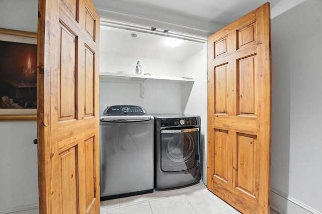 28 Le Mans Ct, Prairie Village, KS 66208 - laundry area with washer and clothes dryer and light tile patterned floors