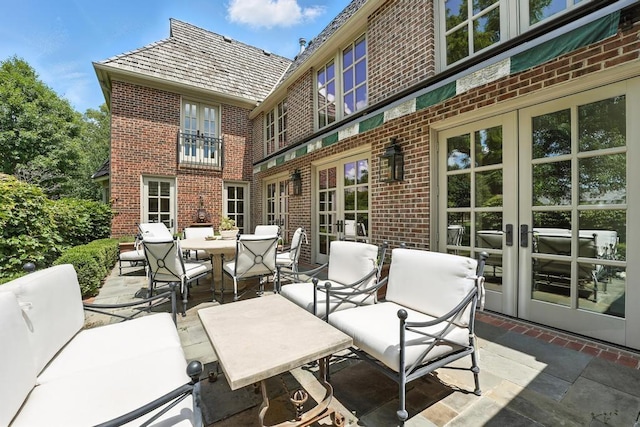 28 Le Mans Ct, Prairie Village, KS 66208 - view of patio featuring french doors and outdoor dining space