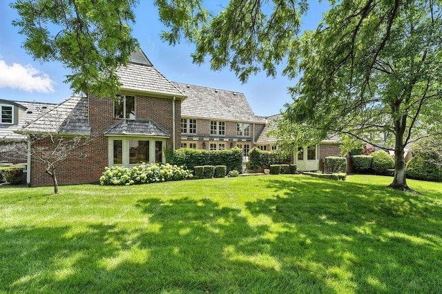 28 Le Mans Ct, Prairie Village, KS 66208 - rear view of house featuring brick siding, a lawn, and a high end roof