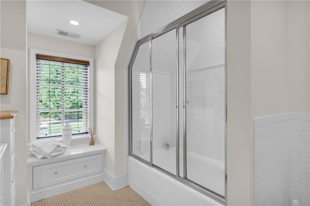 10400 Howe Dr, Leawood, KS 66206 - bathroom featuring enclosed tub / shower combo, healthy amount of natural light, tile patterned floors, and vanity