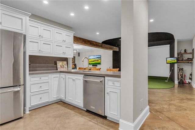 10400 Howe Dr, Leawood, KS 66206 - kitchen featuring appliances with stainless steel finishes, recessed lighting, white cabinetry, beam ceiling, and light tile patterned floors