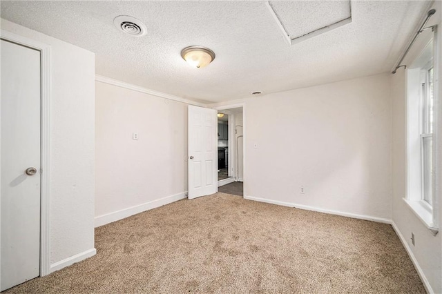 707 N Forest Ave, Independence, MO 64050 - unfurnished bedroom with carpet and a textured ceiling