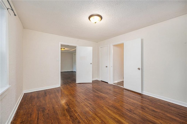 707 N Forest Ave, Independence, MO 64050 - unfurnished room featuring wood finished floors and a textured ceiling