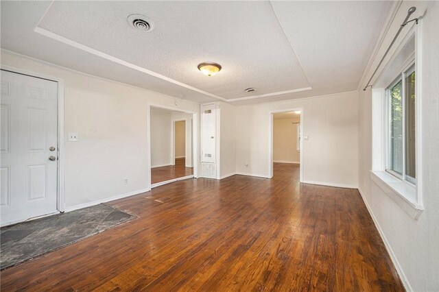 707 N Forest Ave, Independence, MO 64050 - spare room featuring wood-type flooring and a textured ceiling