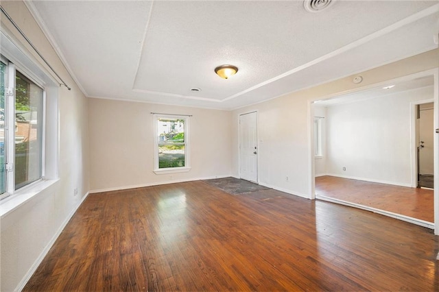 707 N Forest Ave, Independence, MO 64050 - unfurnished room with a raised ceiling and wood finished floors
