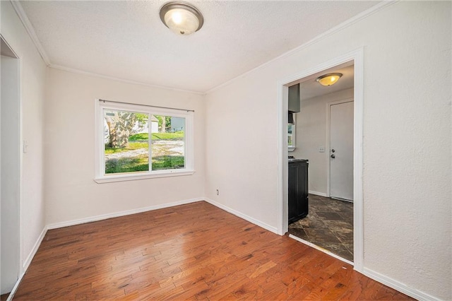 707 N Forest Ave, Independence, MO 64050 - spare room with ornamental molding and wood finished floors