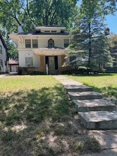 809 W Gregory Blvd, Kansas City, MO 64114 - view of front of house featuring a front lawn