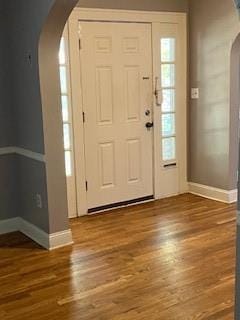 809 W Gregory Blvd, Kansas City, MO 64114 - entrance foyer featuring arched walkways and wood finished floors