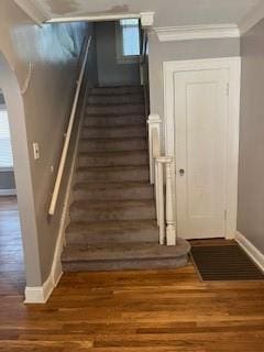 809 W Gregory Blvd, Kansas City, MO 64114 - stairs with wood finished floors, ornamental molding, and arched walkways