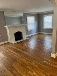 809 W Gregory Blvd, Kansas City, MO 64114 - unfurnished living room with a fireplace with flush hearth, crown molding, and wood finished floors