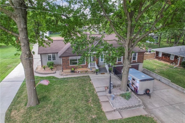 2508 N Mcbride Ave, Sugar Creek, MO 64050 - ranch-style home with brick siding, a front yard, and roof with shingles