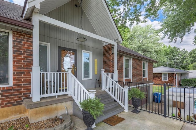 2508 N Mcbride Ave, Sugar Creek, MO 64050 - entrance to property with brick siding and roof with shingles