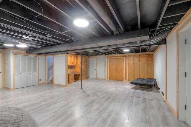 2508 N Mcbride Ave, Sugar Creek, MO 64050 - finished below grade area featuring stairway and light wood-style flooring