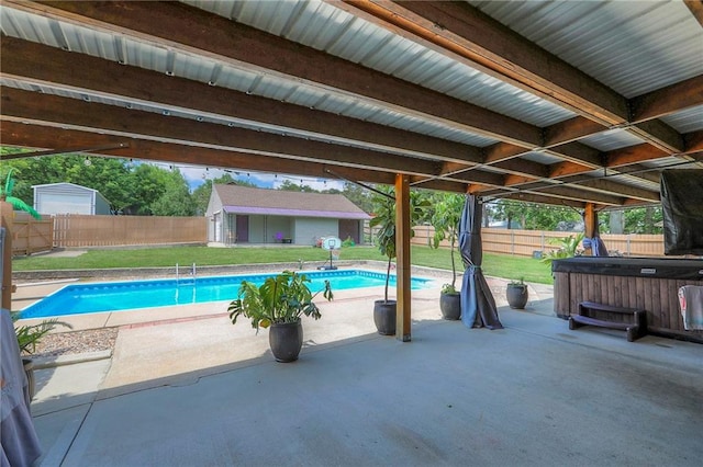 2508 N Mcbride Ave, Sugar Creek, MO 64050 - view of swimming pool with a hot tub, a patio area, a fenced backyard, and an outbuilding