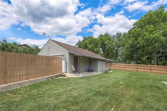 2508 N Mcbride Ave, Sugar Creek, MO 64050 - fenced backyard with a patio area