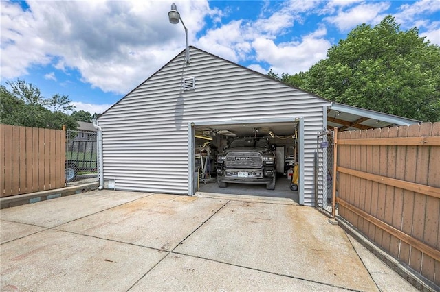 2508 N Mcbride Ave, Sugar Creek, MO 64050 - garage featuring concrete driveway