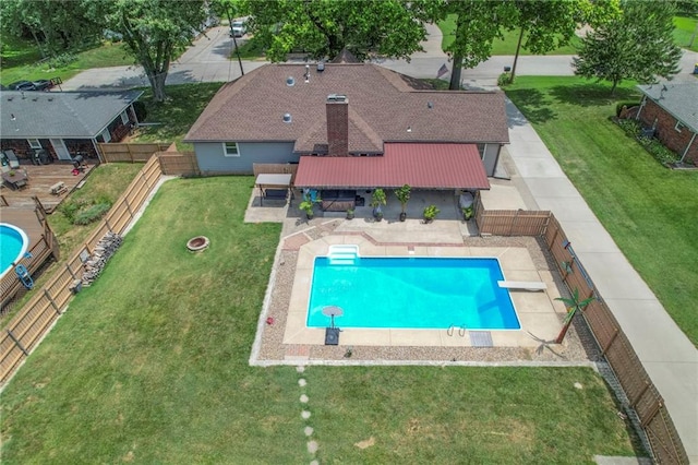 2508 N Mcbride Ave, Sugar Creek, MO 64050 - view of pool with a fenced backyard, a patio, and a diving board