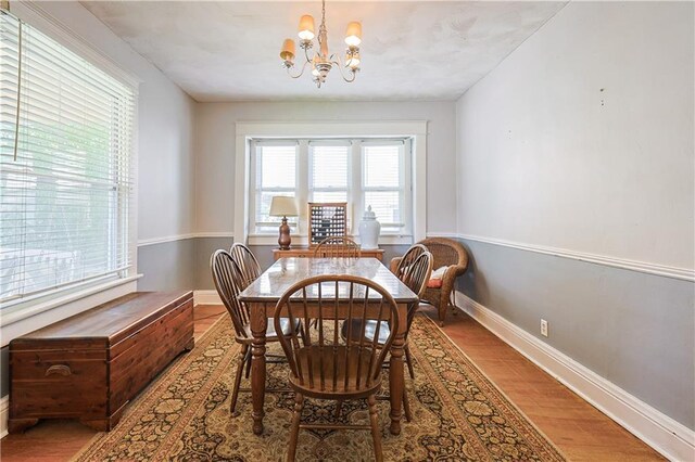 2517 Felix St, Saint Joseph, MO 64501 - dining space with a chandelier, plenty of natural light, and wood finished floors