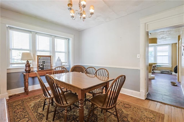 2517 Felix St, Saint Joseph, MO 64501 - dining space featuring healthy amount of natural light, light wood finished floors, and a chandelier