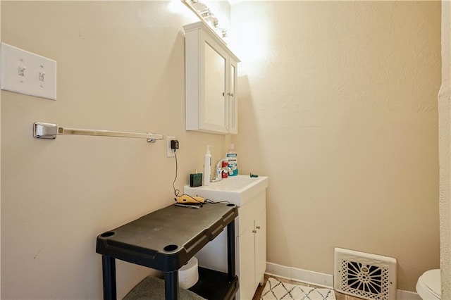 2517 Felix St, Saint Joseph, MO 64501 - bathroom featuring toilet and vanity