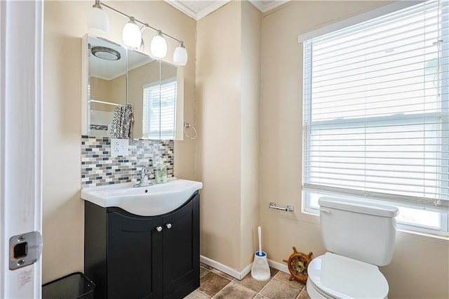 2517 Felix St, Saint Joseph, MO 64501 - bathroom with crown molding, vanity, decorative backsplash, and curtained shower