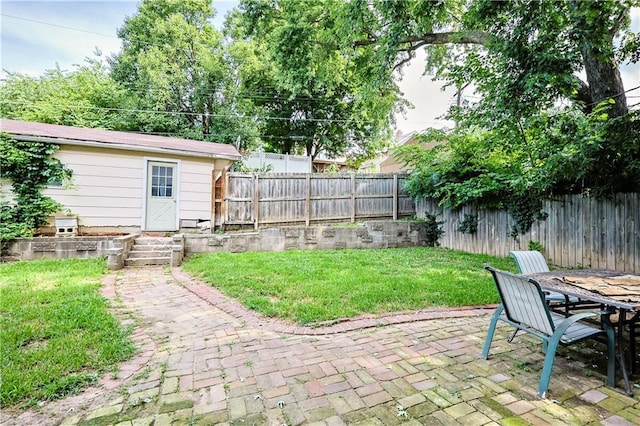 2517 Felix St, Saint Joseph, MO 64501 - fenced backyard featuring a patio area and outdoor dining area