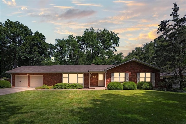 3300 W 93rd St, Leawood, KS 66206 - ranch-style home with a yard, driveway, an attached garage, and brick siding
