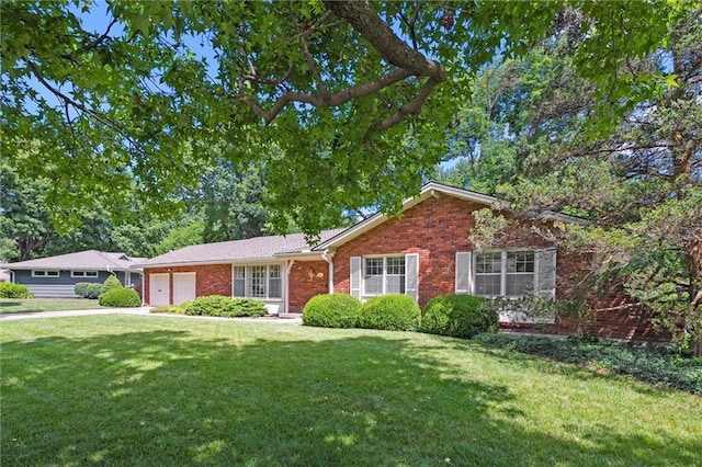 3300 W 93rd St, Leawood, KS 66206 - ranch-style home with a garage, a front yard, brick siding, and driveway