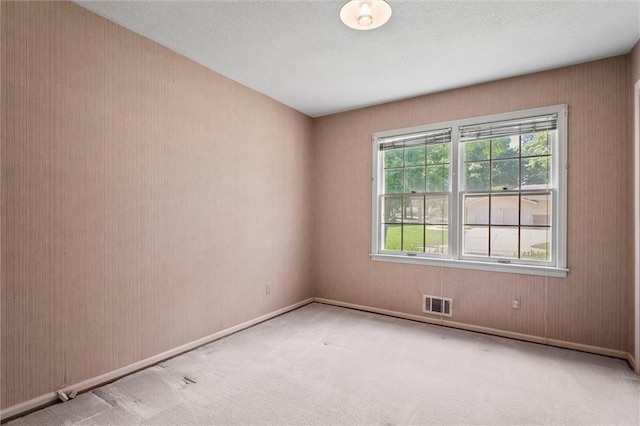 3300 W 93rd St, Leawood, KS 66206 - carpeted spare room featuring a textured ceiling and baseboards