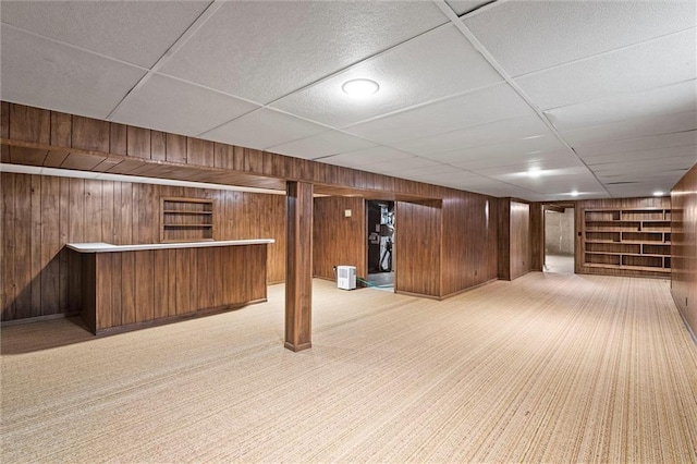 3300 W 93rd St, Leawood, KS 66206 - finished below grade area with carpet flooring, wooden walls, a bar, and built in shelves