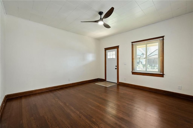 422 N Thompson St, Kansas City, KS 66101 - spare room with dark wood-style flooring and a ceiling fan