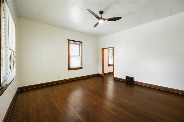 422 N Thompson St, Kansas City, KS 66101 - spare room with ceiling fan, dark wood-style flooring, and crown molding