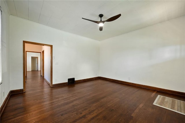 422 N Thompson St, Kansas City, KS 66101 - spare room featuring dark wood finished floors and ceiling fan