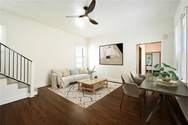 422 N Thompson St, Kansas City, KS 66101 - living room with a ceiling fan, wood finished floors, and stairs