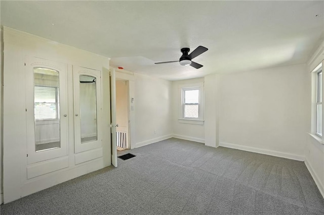 422 N Thompson St, Kansas City, KS 66101 - unfurnished bedroom featuring carpet flooring and ceiling fan